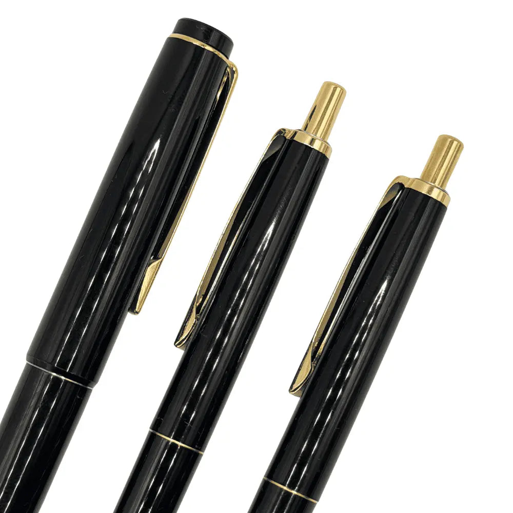 Pilot Vintage Kalem Seti üç kalemin üst kısmı, altın klipsler ve tıklama başlıkları yakın çekim