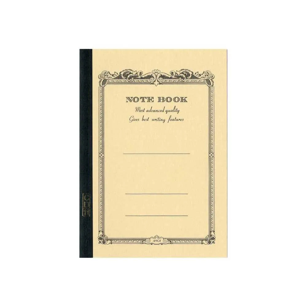 Apica CD-11 A5 defterin sarı kapağı, süslü çerçeveli Note Book baskısı ve siyah bez sırt