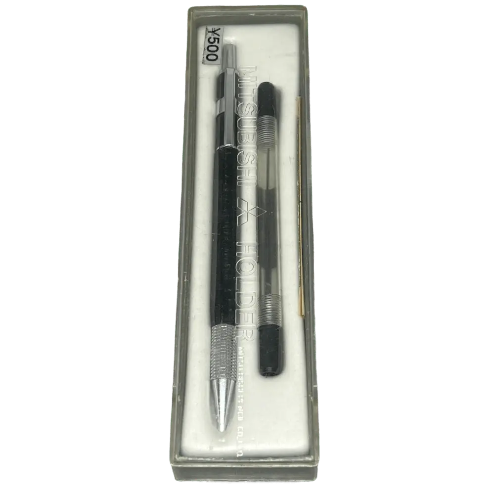 Uni Mitsubishi M5 orijinal ¥500 etiketli şeffaf kutusunda, yanında yedek parçasıyla