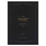 Tomoe River A5 notepad siyah kapağı, altın marka logosu, 100 yaprak ve krem kâğıt bilgisi