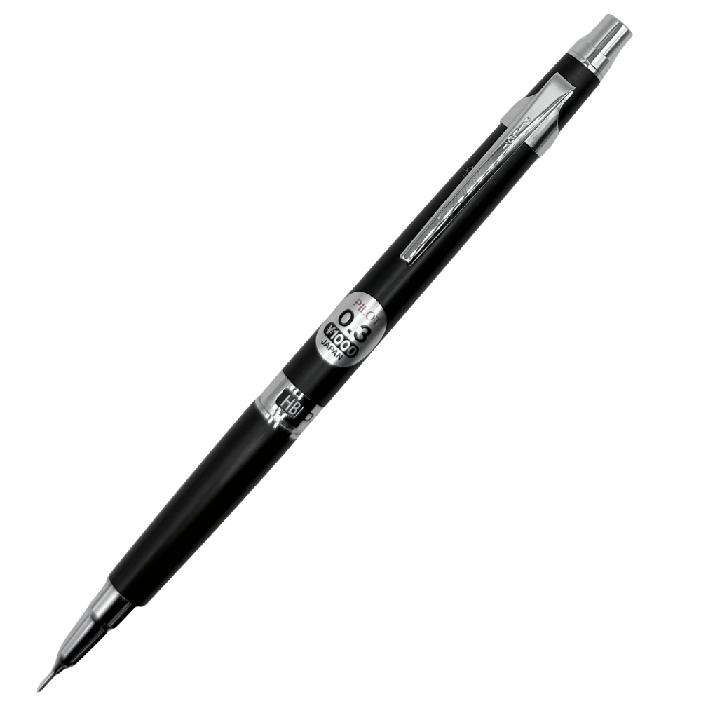 Pilot H-1003 kalem eğik açıdan, gövdedeki 0.3 ve 1000 yen etiketi ile ince metal uç görünüyor
