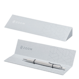 Tombow Zoom L2 kalemin gri üçgen ZOOM ambalajı, kapalı ve içinde kalemle açık hâli